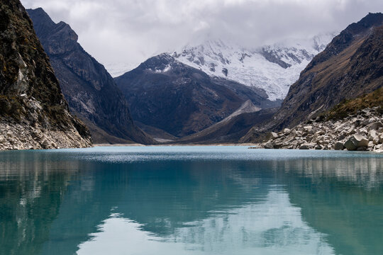 Huaraz, Peru: Reflection of the Laguna Paron and the iconic Piramied Peak in Cordillera Blanca, a famous mountain lake near Caraz in Peru