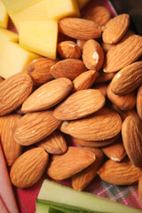 Nut variety and fresh fruit on a colorful table