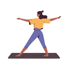 Young woman in sportswear practices yoga