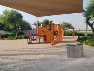Kids Playing Area. Colorful kids playground beautiful garden children amenity area in community society. Children Swings, Kids sliding, Playing Yard Adult play activities in public Safe Sport Park.