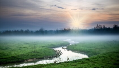 Misty Morning Stream with Sunlight Streaming Through Fog
