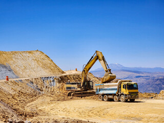 Obraz premium Construction machinery working in open pit mine