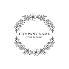 Elegant floral wreath design with company name and tagline for branding.