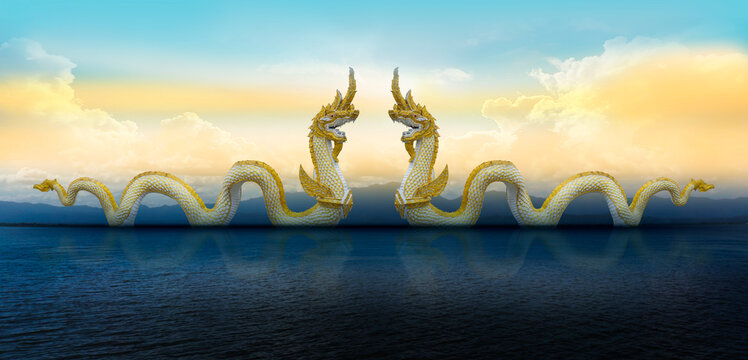 Beautiful with blue sky and two king of Nagaes statue at the holy lake of Phayao, Phayao, Thailand