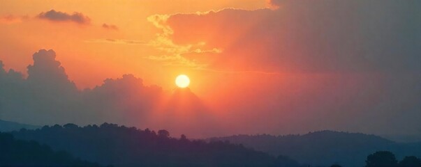 Fototapeta premium Serene Sunset Hazy Orange and Pink Sky with Thick Clouds, Peaceful and Mysterious Atmosphere