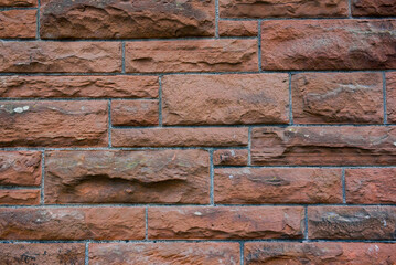 Rows of orange bricks neatly aligned, ideal for constructing strong and durable buildings.
