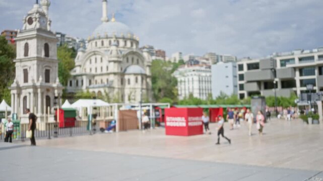 Istanbul square with domed mosque and clock tower, soft blurred bokeh background; background backplate copyspace.