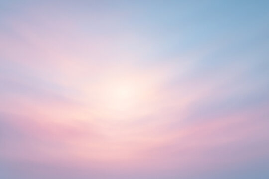 Dreamy pastel sky with soft pink and blue light blending in a serene atmosphere
