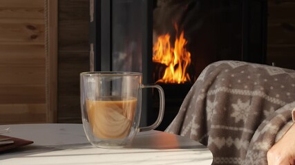 Rustic cabin scene with glowing fire soft blanket and hot drink captures winter mood Warm interior radiates comfort cozy vibe emphasizes comfort peaceful details reflect comfort in rural lifestyle