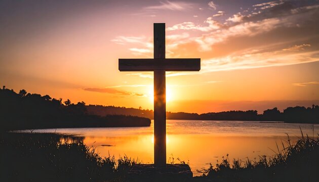 Silhouette of a wooden cross against a stunning sunset backdrop