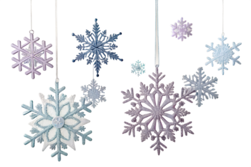 Collection of sparkling decorative snowflakes hanging and isolated on transparent background