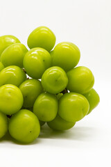 green large grapes on a white background close-up