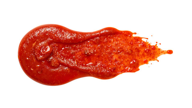 Spicy tomato sauce splash isolated on white, hot red condiment texture for cooking, pizza, pasta, and culinary design