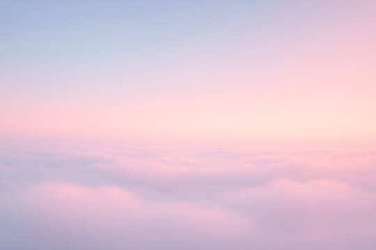 Dreamy pastel horizon above the clouds with soft pink and blue light