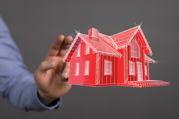 A hand reaching towards a digitally rendered house, symbolizing home ownership, architectural...