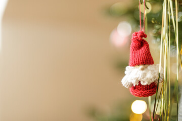 Close up shot of a cute, handmade Santa Claus ornament. Festive holiday decoration, perfect for Christmas or seasonal designs. Warm and inviting