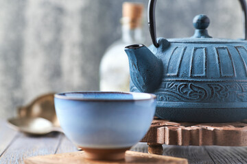 Japanese Cast Iron Teapot on bright background.	