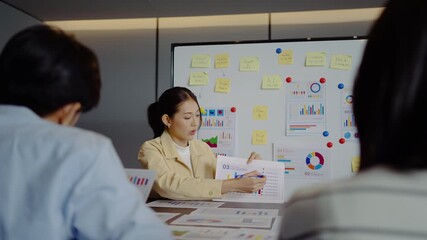 Asian businesswoman startup presenting data chart project management meeting with colleagues, financial report analysis teamwork strategy plan corporate success at office, marketing, data analytics - Powered by Adobe