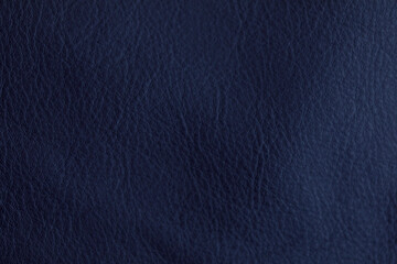 Close-up shot of navy blue leather texture, ideal for backgrounds and design elements. Perfect for adding a touch of luxury and depth to any pro