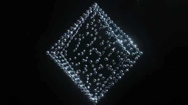 A carbon atoms bonding into the perfect, rotating lattice structure of a diamond. A visualization of strength and beauty on a molecular scale.