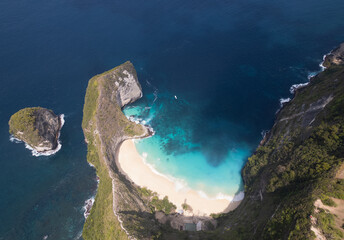Kelingking beach and famous cliff in Nusa Penida island aerial drone view