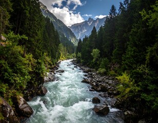 A flowing river through a deep mountain valley surrounded by lush trees