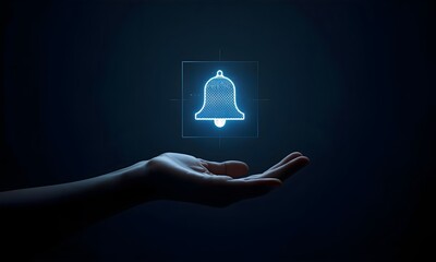 Hand reaching for glowing blue notification bell icon in darkness