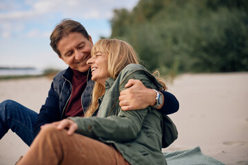 Carefree mature couple spending autumn day together in nature.