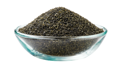 A close-up of a clear glass bowl filled with a mound of dark green, small granular substance