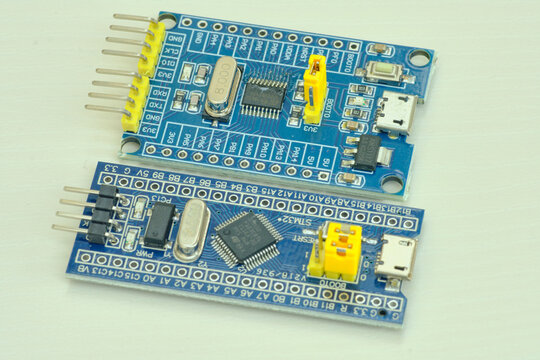 Programming board of Arduino UNO in blue colour isolated in white background