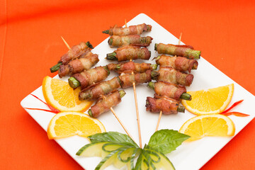 Grilled skewers with decorative plating and fresh vegetable garnish