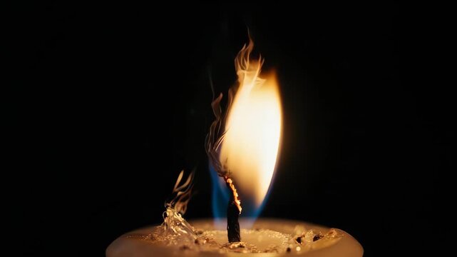 A beautiful macro slow-motion shot of a candle flame. The different temperature zones and invisible convection currents are made visible in this scientific view.