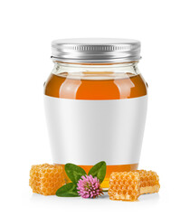 Oval Shaped Glass Jar of Orange Blossom Honey with metal cap with label area and surrounded by fresh orange blossom flower honeycomb and leaves