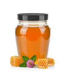 Oval Shaped Glass Jar of Orange Blossom Honey with glossy cap without label area and surrounded by fresh orange blossom flower, honeycomb and leaves