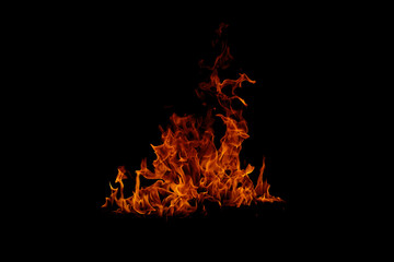 Blazing fire and glowing flames on a dark background perfect for creative design and visual effects.
