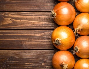 Golden brown onions clustered on a richly toned, textured wooden surface