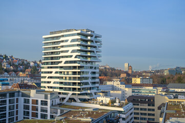 Cityscape featuring modern apartment buildings in Stuttgart, Germany under clear blue skies