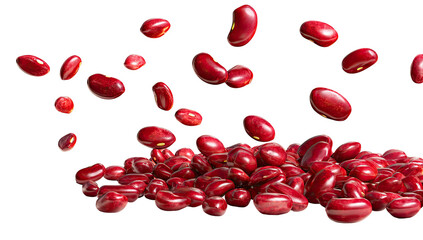Vibrant red kidney beans, some falling, some piled, against a stark black background