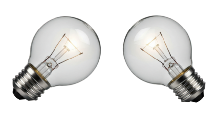 Pair of lit incandescent bulbs on black. Silver bases, bright filament glow