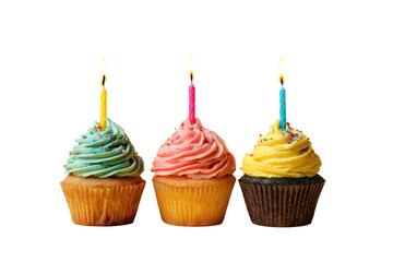 Three cupcakes frosted in pastel colors, with lit candles, set against a dark background