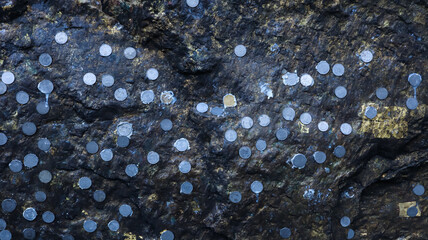 India, Bihar, Bodh Gaya, People Sticking Coins on Rock in Cave As Sacred Fate, Lord Buddha Meditation Cave Bodh Gaya.