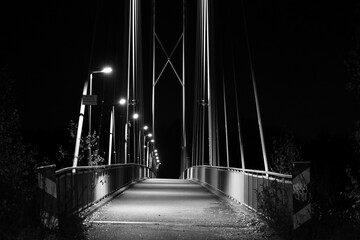 Suspension bridge at night with lights