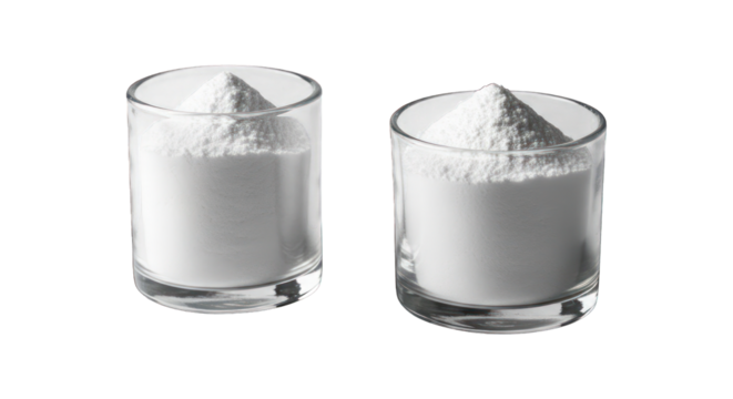 Two clear glasses filled with piles of white powder against a black background