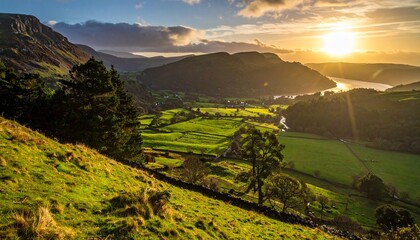 Mountainous landscape with terraced green fields river valley hillside houses and snow-capped peaks under sunlight for editorial travel photography rural harmony and scenic nature-themed visuals