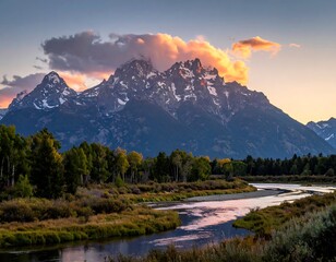 Scenic mountain range and river under a beautifully lit sunset sky