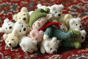 Elf napping in stuffed animal pile