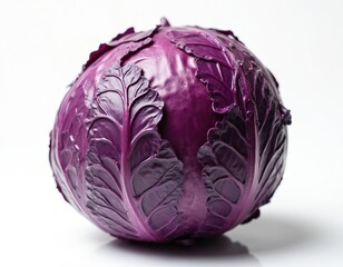 Obraz premium Whole purple cabbage with detailed leaf texture is presented on clean white backdrop. This vibrant vegetable offers crispness and health benefits for your food designs.
