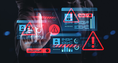 Cybersecurity threat warning hologram concept with digital alerts and data theft indicators on...