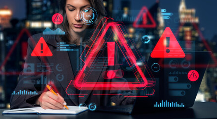 Woman analyzing cybersecurity threats with warning holograms in