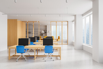 Modern open space office interior with wooden desks, blue chairs, and large windows in a high-rise building on a bright day. 3D Rendering